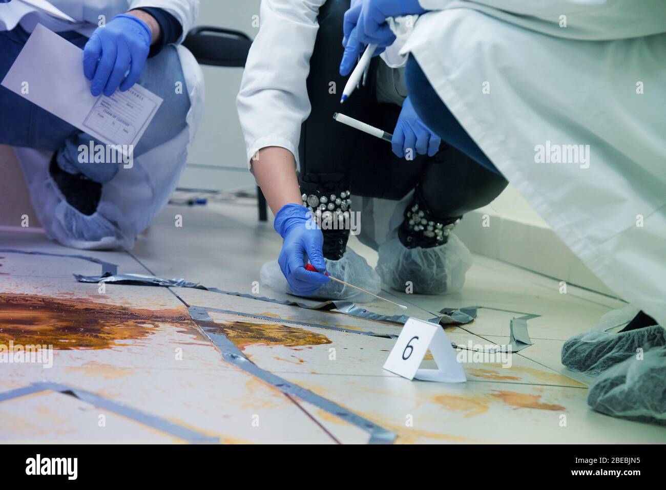 Forensic Technicians Taking Dna Sample From Blood Stain With Cotton Swab On Murder Crime Scene